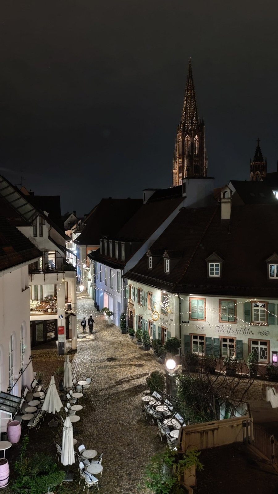 Freiburg Minster at night above the old town